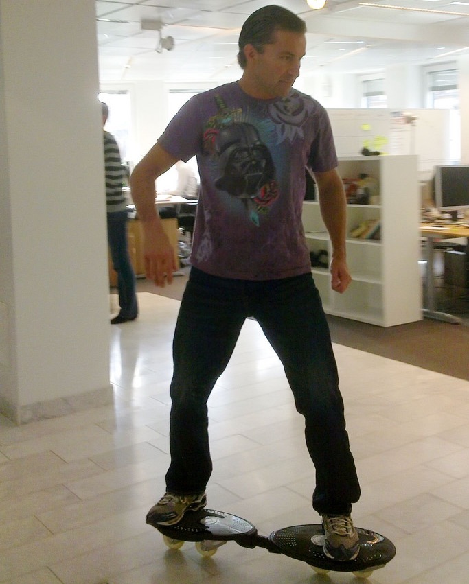 Spotify executive Martin Lorentzon seen casterboarding around the office