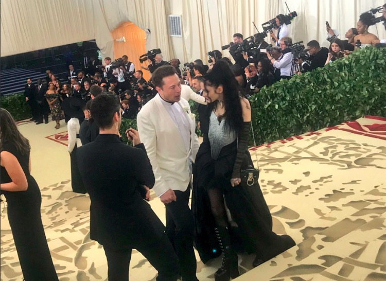 Elon Musk appearing with his new girlfriend, Grimes, at Met Art Gala last weekend.