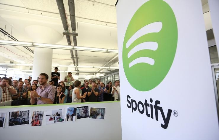 There's a reason why these Spotify employees are smiling.