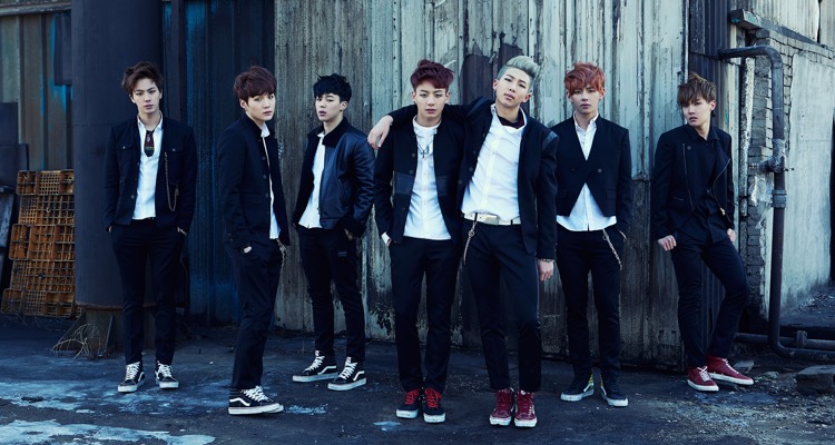 Rap Monster poses with the BTS supporting cast. It's one of Kpop's fastest-growing stories, with increasing pressure on staying together.
