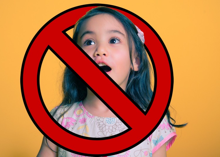Image: Girl singing with 'banned' symbol over it. Universal Music Publishing Group is actively ripping down Facebook cover song videos
