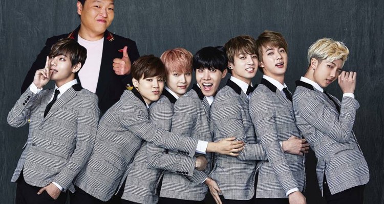 PSY, pictured with members of BTS