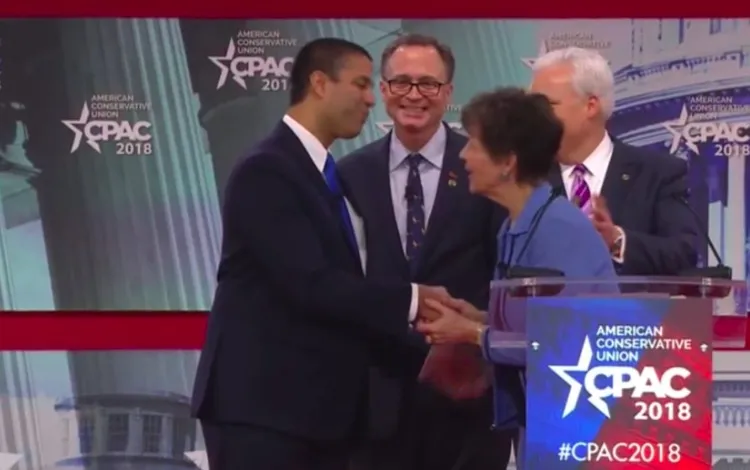 FCC Chairman Ajit Pai accepts the 'Charlton Heston Courage Under Fire' award from the NRA at CPAC 2018.