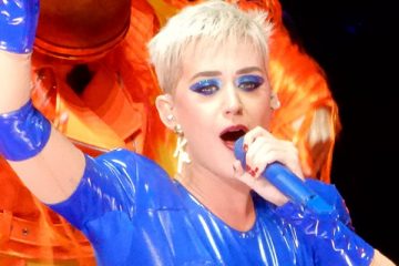 Katy Perry at Madison Square Garden holding a blue microphone in 2017