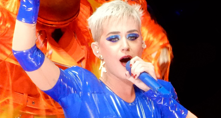 Katy Perry at Madison Square Garden holding a blue microphone in 2017