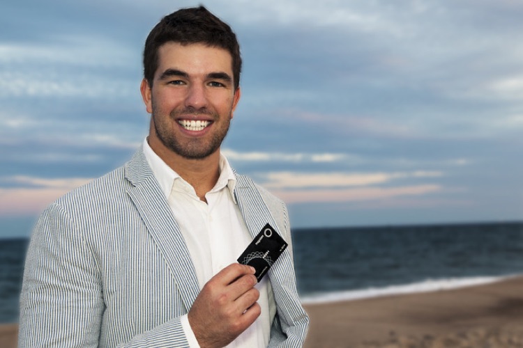 A flashy McFarland shows off one of his scams: the Magnises credit card.