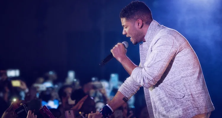 Jussie Smollett, known for his role as Jamal Lyon on the television series Empire, performs at Yokota Air Base, Japan, Dec. 15, 2015. As part of the United Service Organizations Empire tour, cast members participated in meet and greets, spoke with Yokota High School youth and hosted and performed a family-friendly White Party. Smollett said that the tour was a great opportunity for him to give back and share thanks to service members. (U.S. Air Force photo by Airman 1st Class Delano Scott/Released)