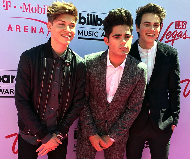 Ricky Garcia (l) with members of boy band Forever In Your Mind in 2016 (photo: Taylore Fowler CC by SA 3.0)