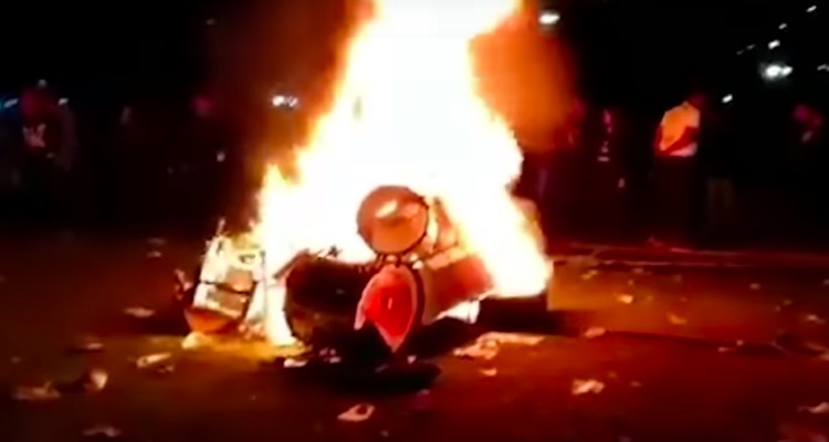 Evanescence's drum kit being torched by angry fans.