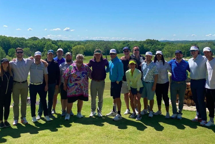 Morgan Wallen (center) flanked by members of Big Loud Records at a golf outing earlier this week (photo: Instagram)