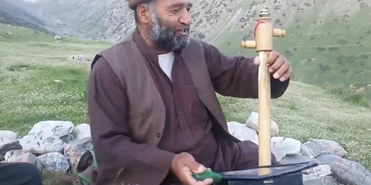 Fawad Andarabi performing in the mountainous Afghanistan countryside