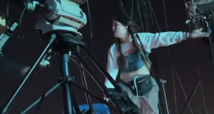 An unidentified woman frantically attempts to get staffers to shut down the Astroworld performance, to no avail. (Photo Credit: Twitter)