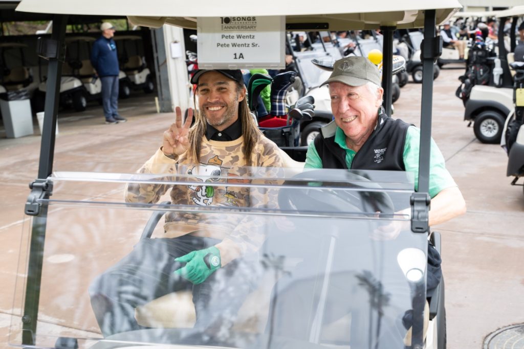 Fallout Boy's Pete Wentz and father Pete Wentz, Sr. prepare to tee off at the NMPA SONGS Foundation Golf Tournament on Monday at Riviera Country Club on Monday (Photo: NMPA)